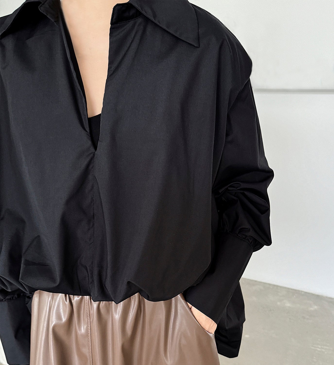 Black Hi-Lo shirred shirt by DIGS, featuring a relaxed fit with gathered detailing and a stylish high-low hem.