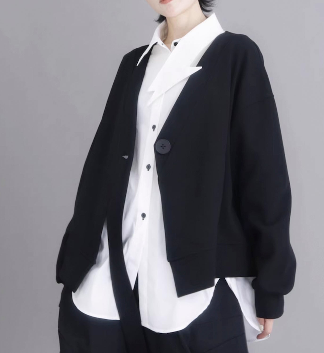 DIGS button sweatshirt cardigan showing a cozy, knitted design with button closure and a relaxed fit, perfect for casual wear.