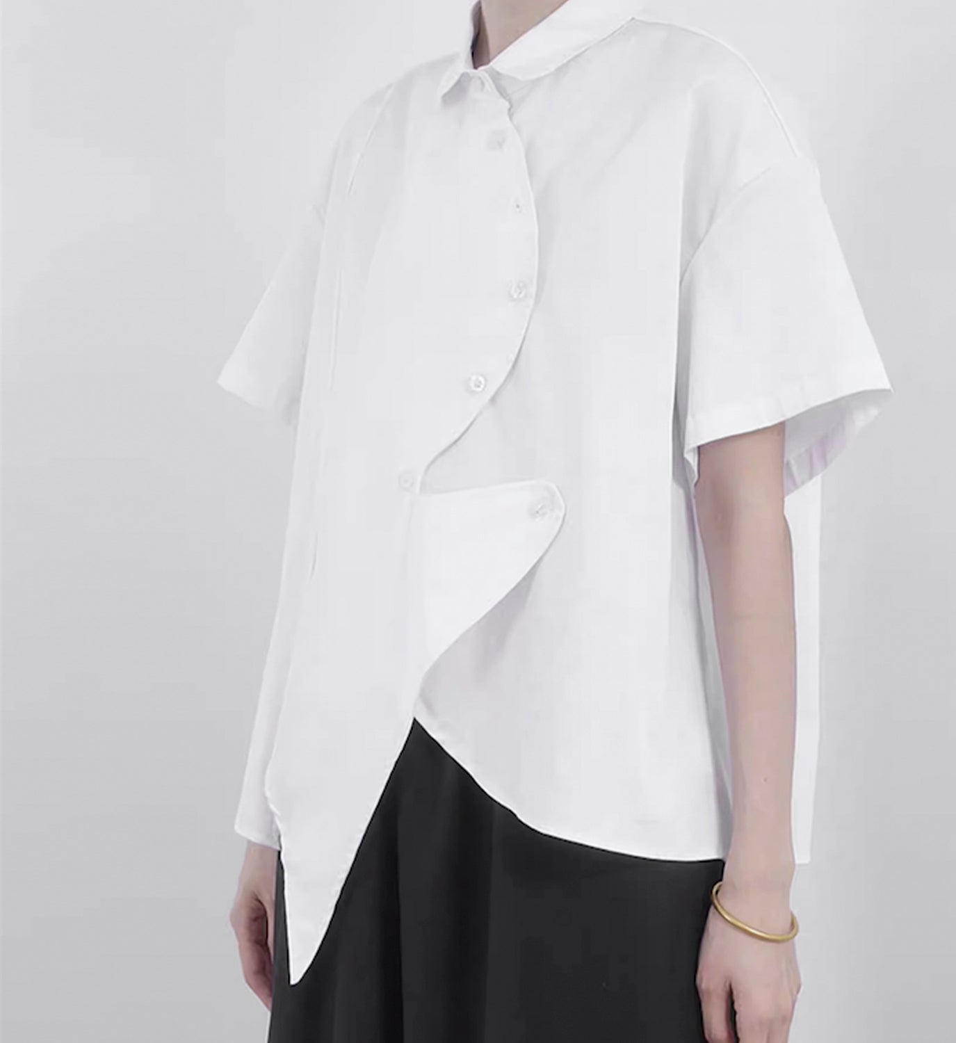 Light blue DIGS Poplin Point Shirt with a classic collar and button-front design, displayed on a hanger.