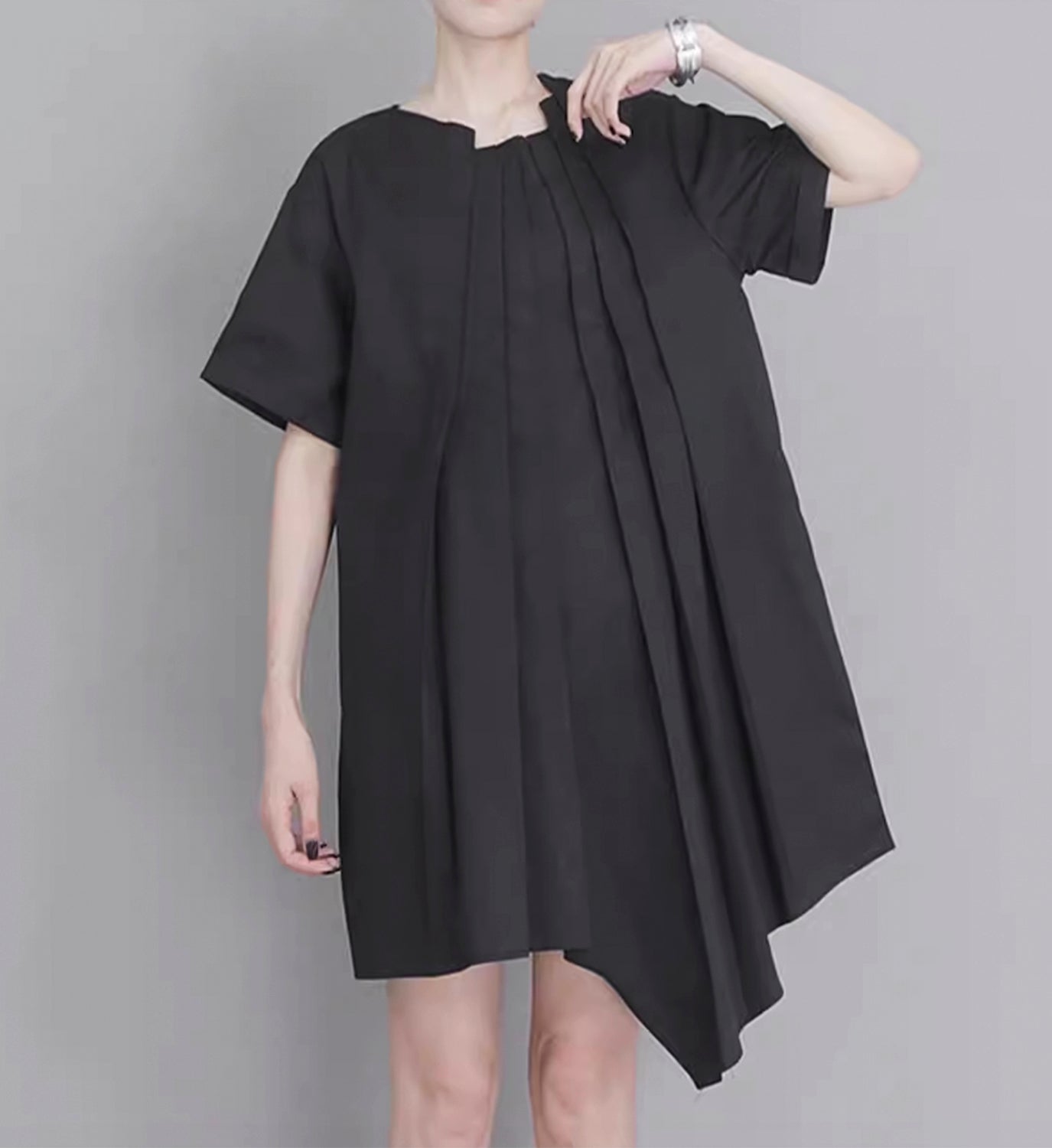 Light blue DIGS poplin pleated short dress with a fitted bodice and flared skirt, displayed on a hanger against a white background.